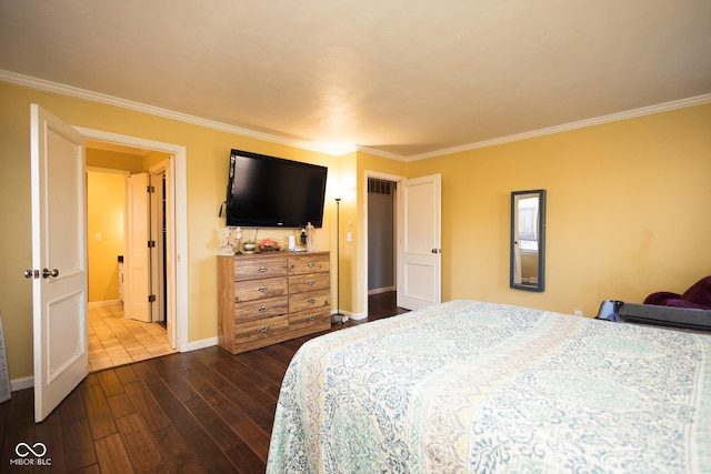 bedroom with ornamental molding and dark hardwood / wood-style floors