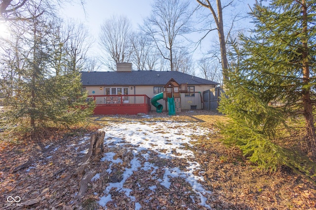 view of front of property with a playground