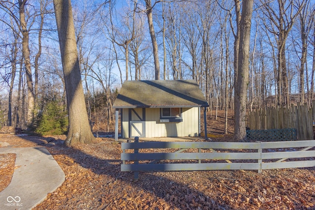 view of front of home featuring a shed