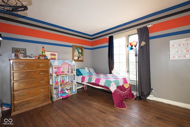 bedroom with wood-type flooring