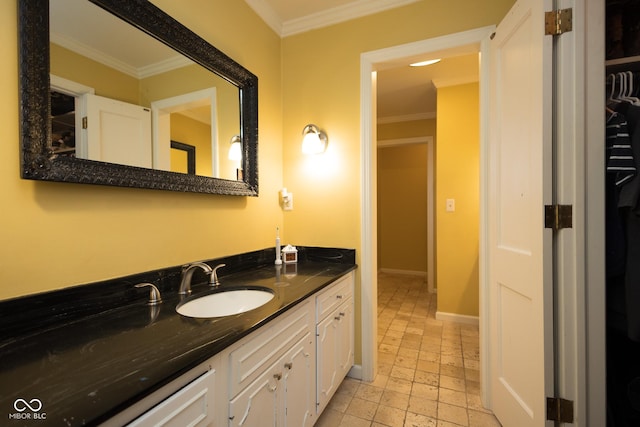 bathroom with vanity and ornamental molding