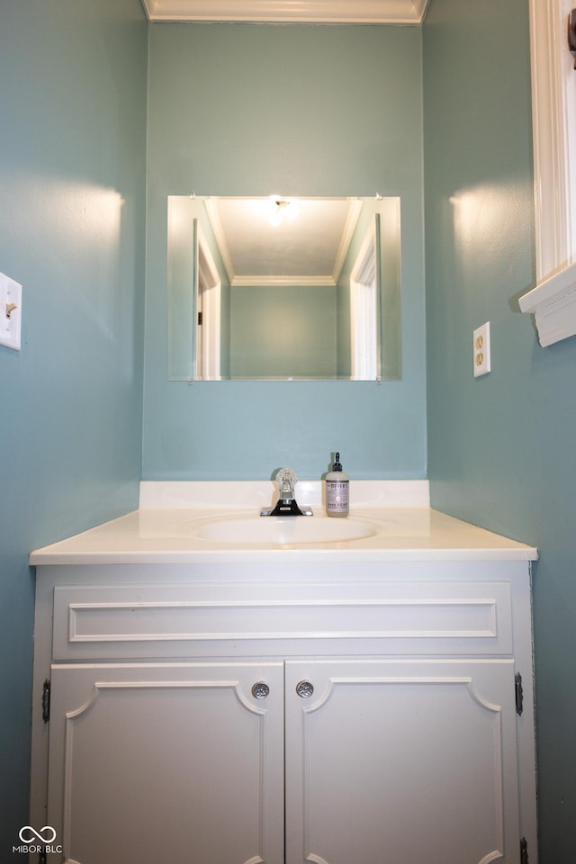 bathroom featuring vanity and ornamental molding