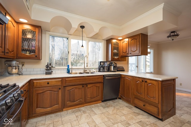 kitchen featuring sink, decorative light fixtures, stainless steel dishwasher, ornamental molding, and kitchen peninsula