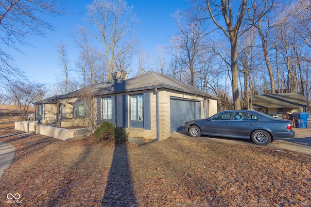 view of side of property featuring a garage