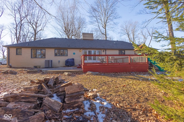 rear view of house with central AC, a patio area, and a deck