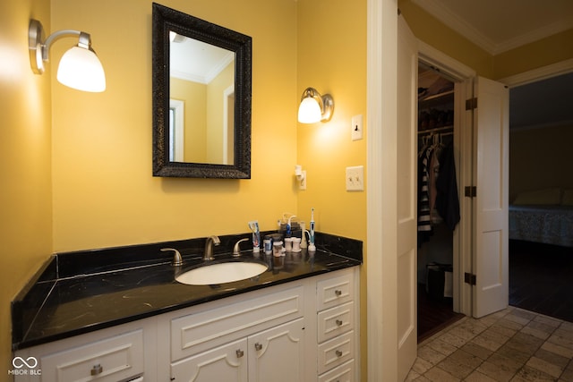 bathroom with vanity and crown molding