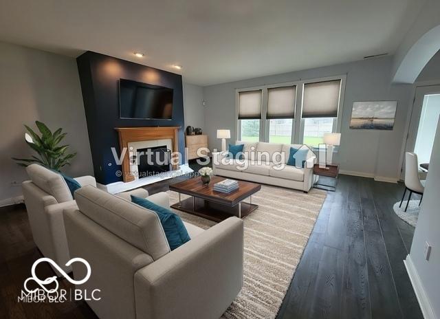 living room with dark hardwood / wood-style flooring