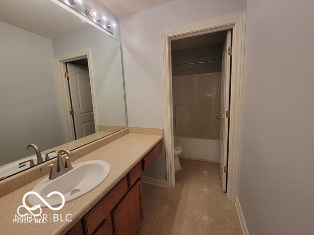 full bathroom with vanity, toilet, bathing tub / shower combination, and tile patterned flooring