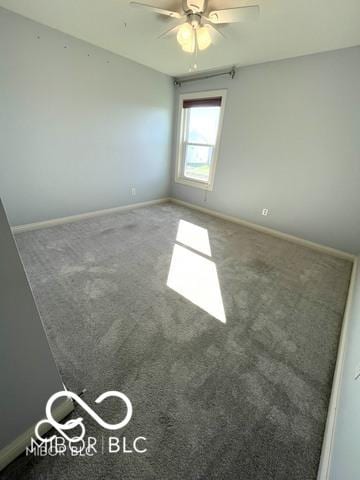 spare room with carpet floors and ceiling fan