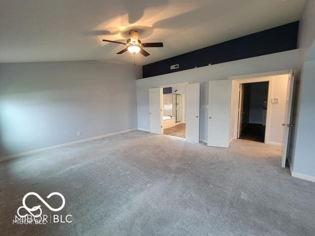 unfurnished bedroom with ensuite bath, light colored carpet, and ceiling fan