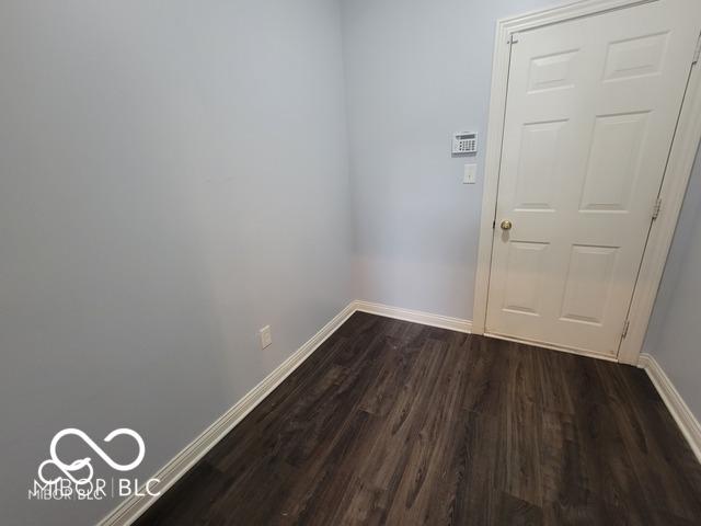 empty room featuring dark hardwood / wood-style floors