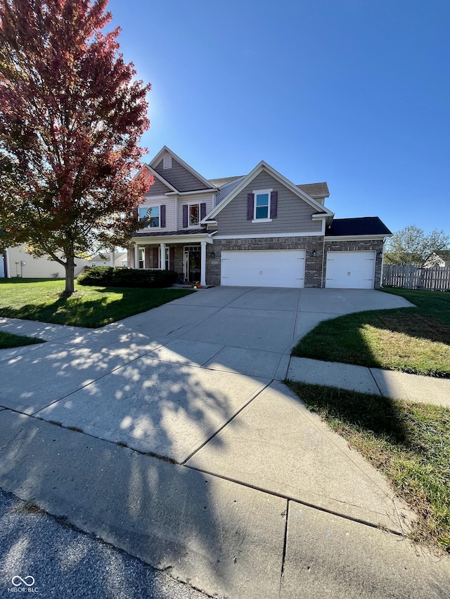 view of front facade with a garage and a front lawn