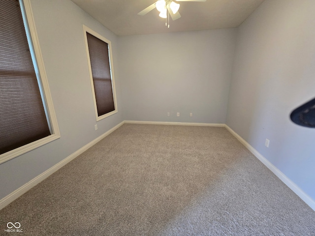 unfurnished room with carpet floors and ceiling fan