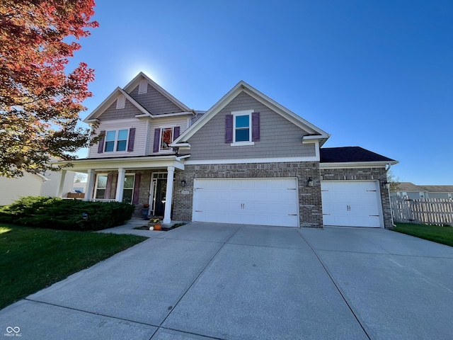 craftsman-style home featuring a garage and covered porch