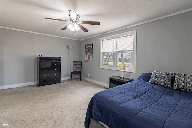 bedroom featuring a textured ceiling, crown molding, baseboards, and carpet floors