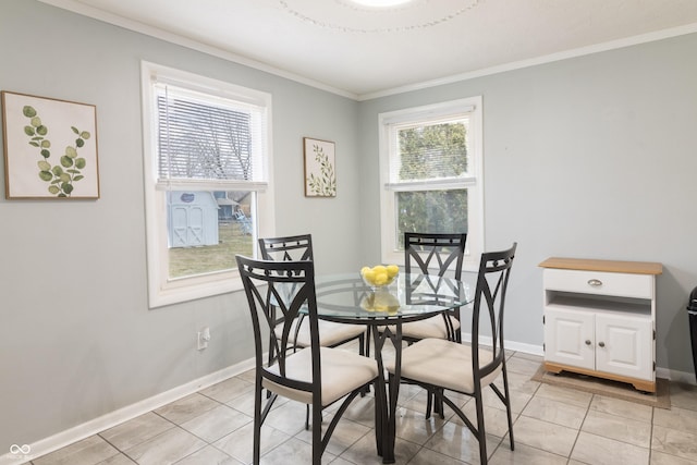 dining room featuring crown molding, light tile patterned flooring, and baseboards