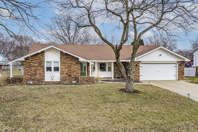 ranch-style home featuring a garage, a front yard, concrete driveway, and brick siding