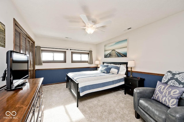 bedroom featuring ceiling fan and carpet flooring