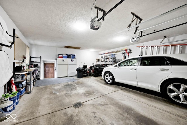 garage featuring a garage door opener and white fridge