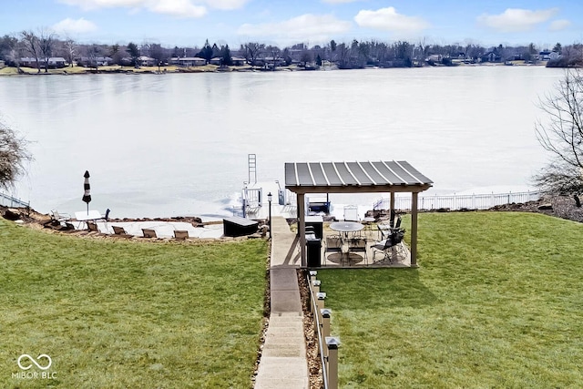 dock area with a water view and a lawn