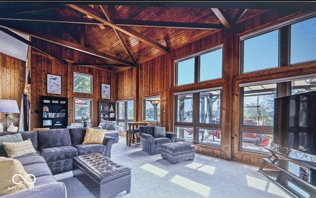 living room featuring lofted ceiling, carpet, wooden ceiling, and wood walls