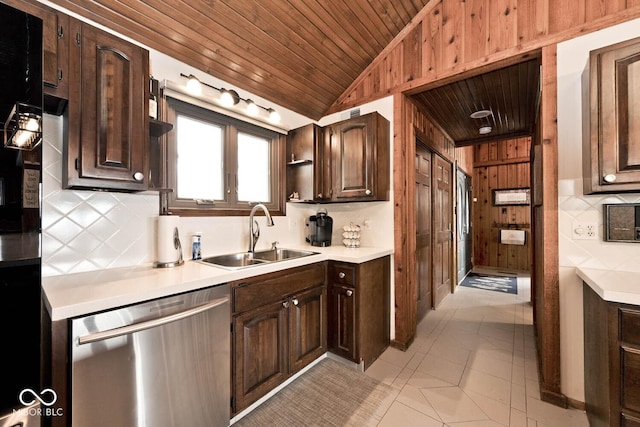 kitchen with vaulted ceiling, sink, stainless steel dishwasher, dark brown cabinetry, and wooden ceiling