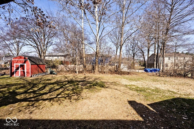 view of yard featuring a shed and an outdoor structure