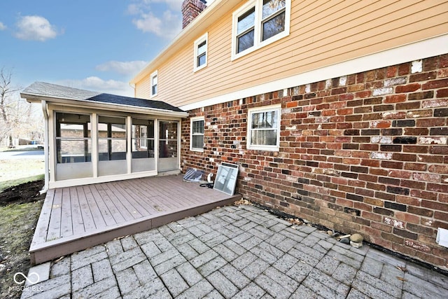 wooden terrace with a sunroom