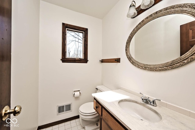 bathroom with visible vents, baseboards, toilet, tile patterned floors, and vanity