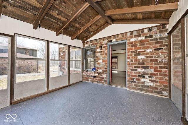 unfurnished sunroom with wood ceiling and lofted ceiling with beams