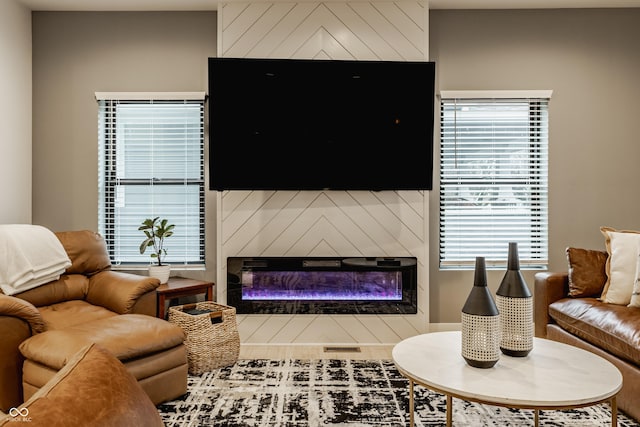 living room with a large fireplace