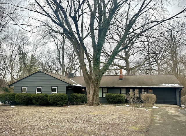 single story home featuring a garage