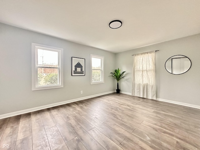 empty room with light wood-type flooring