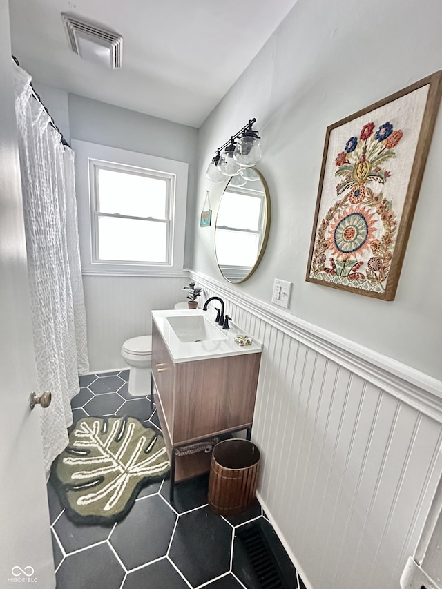 bathroom with vanity and toilet