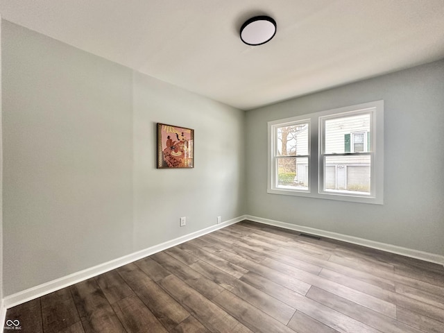 unfurnished room with hardwood / wood-style floors