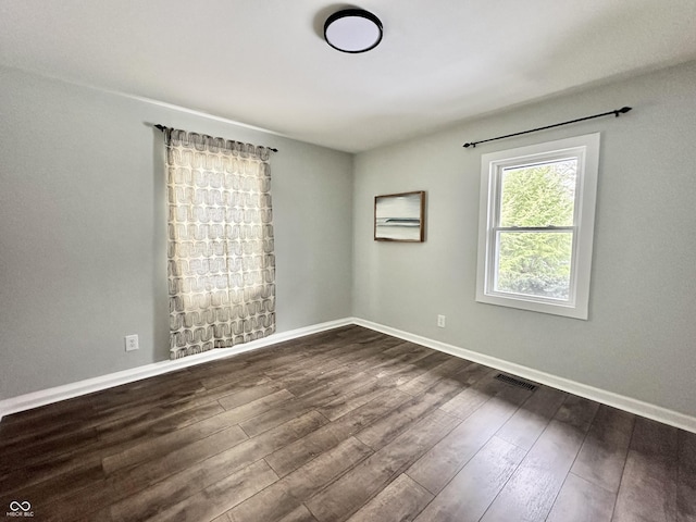 spare room with hardwood / wood-style flooring