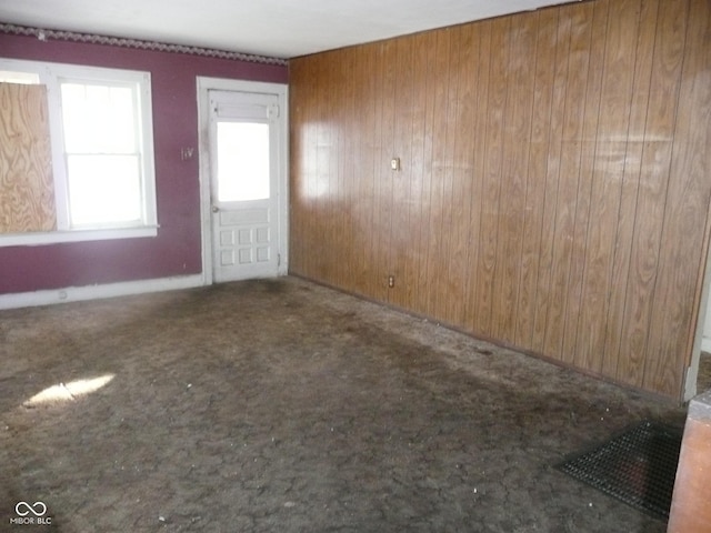 interior space featuring wooden walls