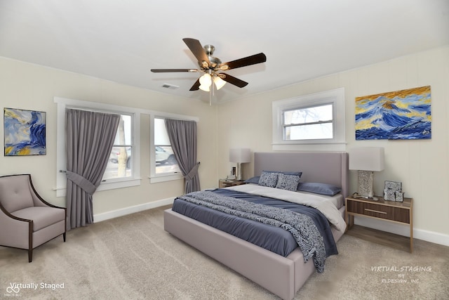 bedroom featuring light colored carpet and ceiling fan