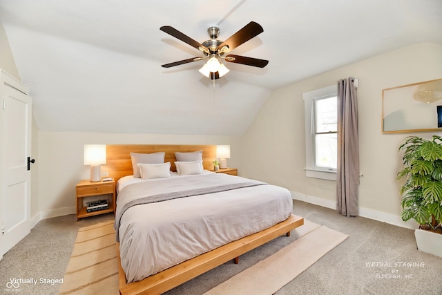 bedroom featuring lofted ceiling, light carpet, and ceiling fan