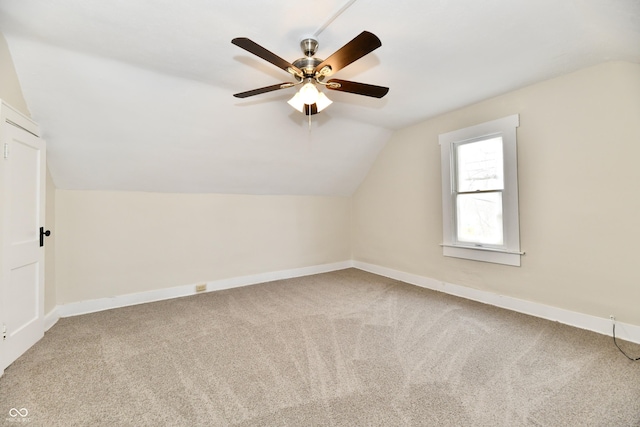 bonus room featuring vaulted ceiling, ceiling fan, and carpet