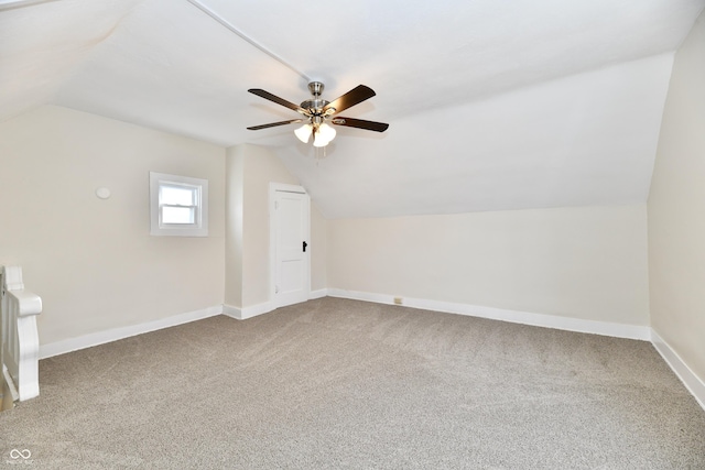 bonus room with vaulted ceiling, carpet floors, and ceiling fan