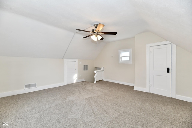 bonus room featuring vaulted ceiling, carpet, and ceiling fan