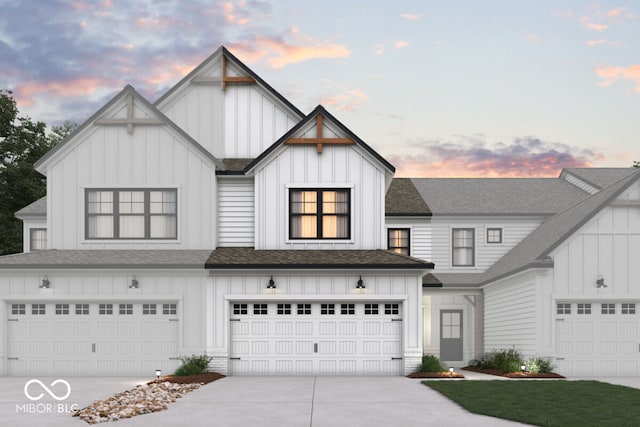 modern farmhouse style home featuring driveway, a garage, board and batten siding, and roof with shingles