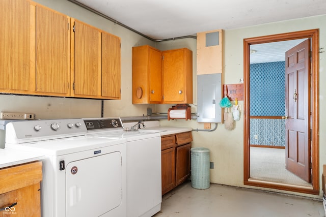 washroom with cabinets, separate washer and dryer, and electric panel