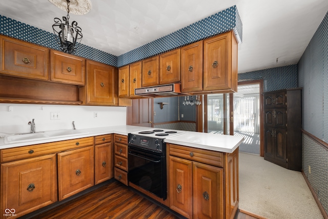 kitchen featuring range with electric cooktop, dark hardwood / wood-style flooring, kitchen peninsula, and sink