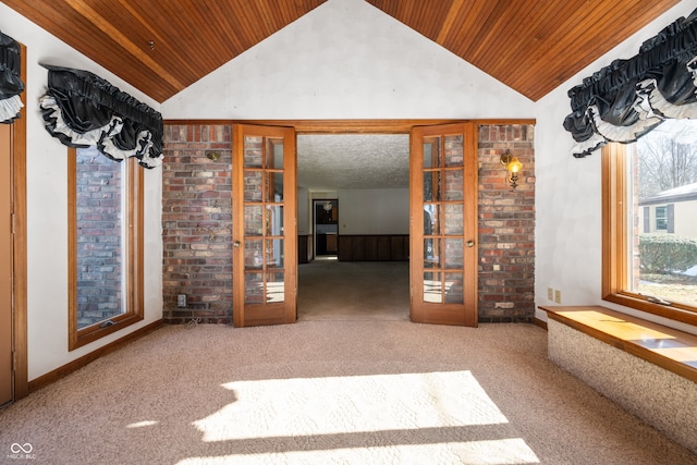 interior space with french doors, wood ceiling, and high vaulted ceiling