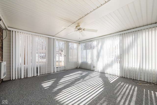 unfurnished sunroom with a wealth of natural light and ceiling fan