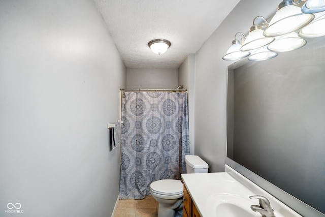 bathroom featuring tile patterned floors, toilet, a textured ceiling, vanity, and a shower with shower curtain