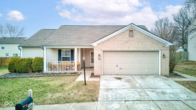 single story home featuring a garage, covered porch, and a front yard