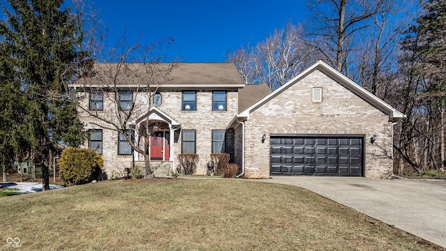 view of front of property with a garage and a front lawn